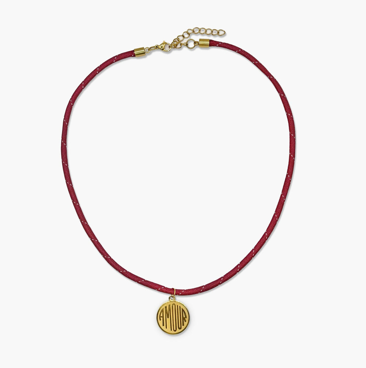 Isla Sol Amour Cord Necklace, burgundy cord with a gold medallion engraved AMOUR