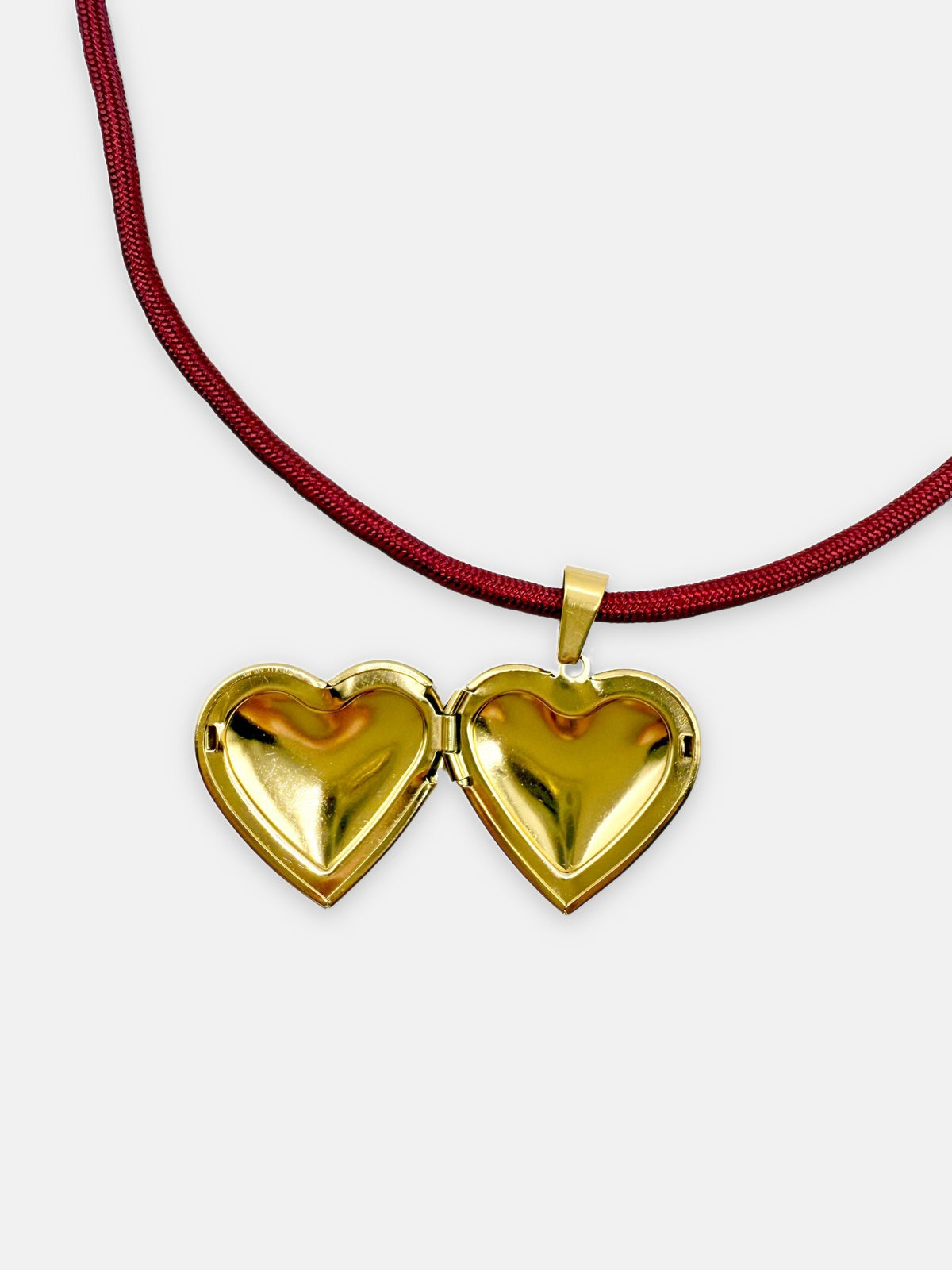 Gold heart locket on the Isla Sol Burgundy Love Necklace, shown open
