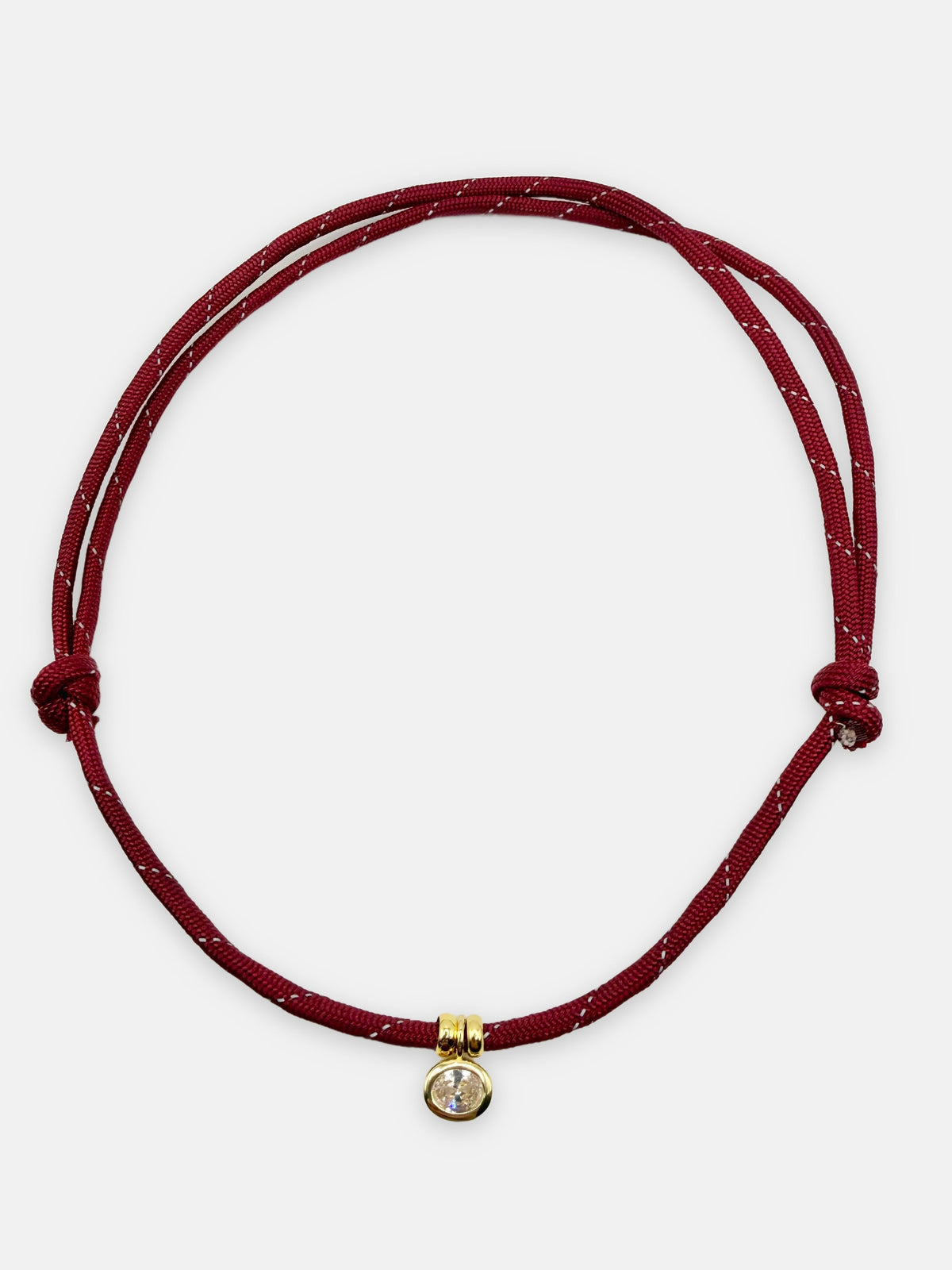 Isla Sol Summit Necklace in Merlot red paracord with gold bezel-set rhinestone charm