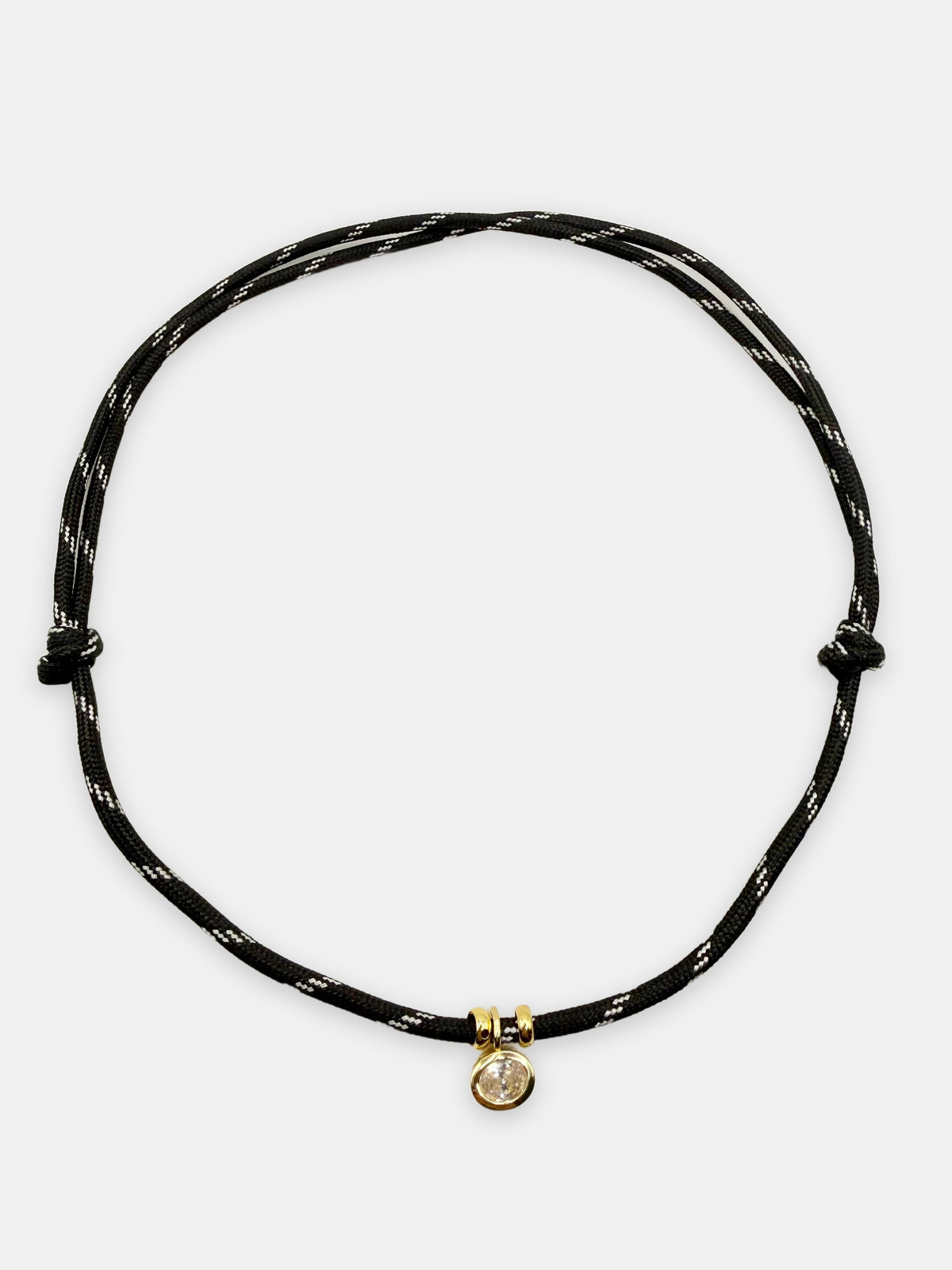 Isla Sol Summit Necklace in Midnight black paracord with gold bezel-set rhinestone charm