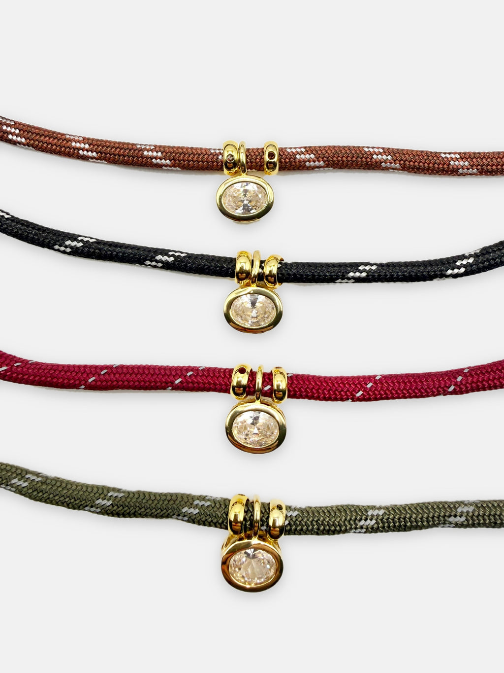 Isla Sol Summit Necklace in Chestnut, Midnight, Merlot, and Moss paracord with gold bezel-set rhinestone charms