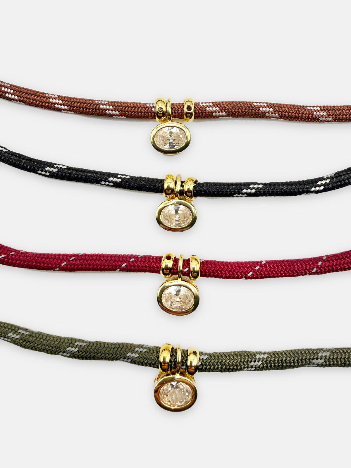 Isla Sol Summit Necklace in Chestnut, Midnight, Merlot, and Moss paracord with gold bezel-set rhinestone charms